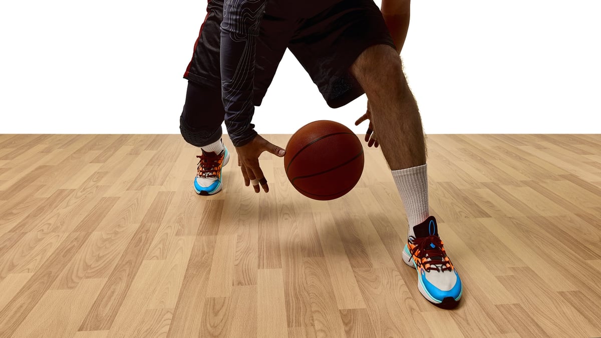 Athlete in bright sneakers on a basketball court